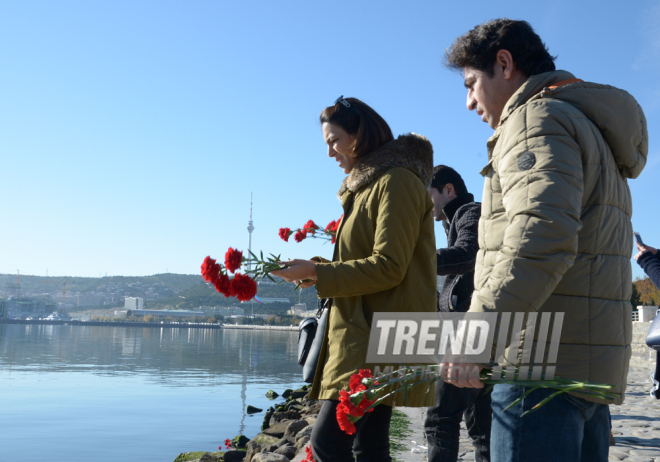 Baku residents bringing flowers to Seaside Boulevard to honor missing oil workers.  Azerbaijan, Dec.07, 2015